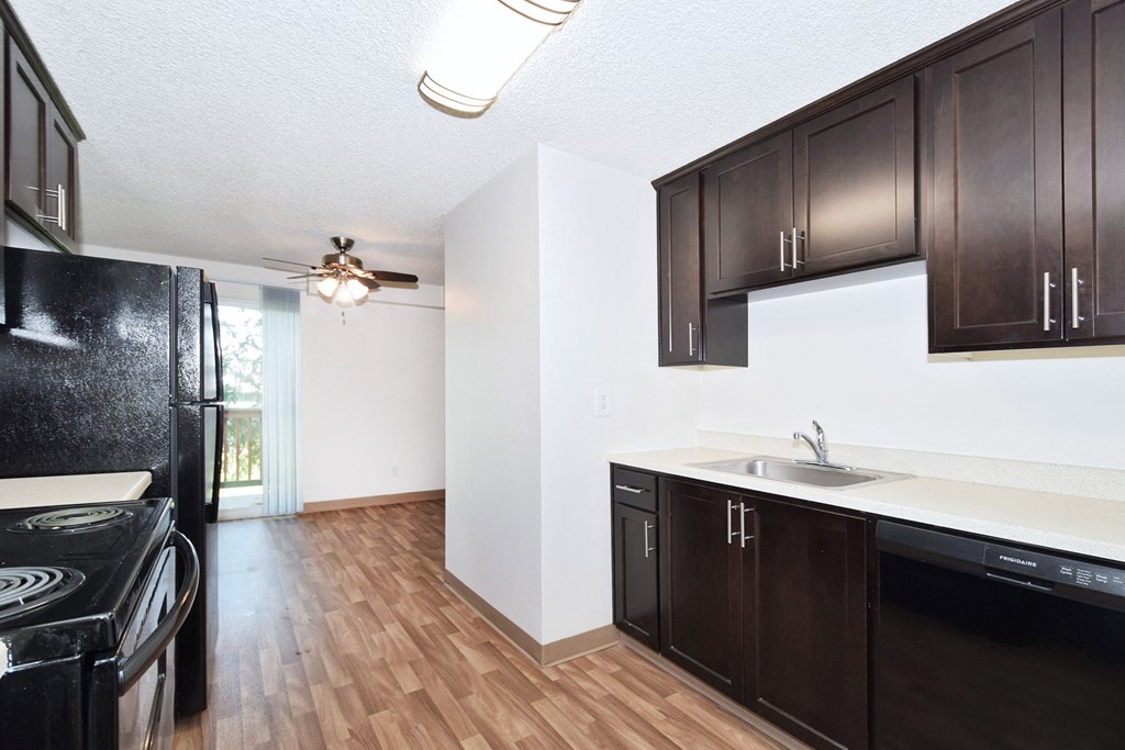 a kitchen and dining area in a 555 waverly unit