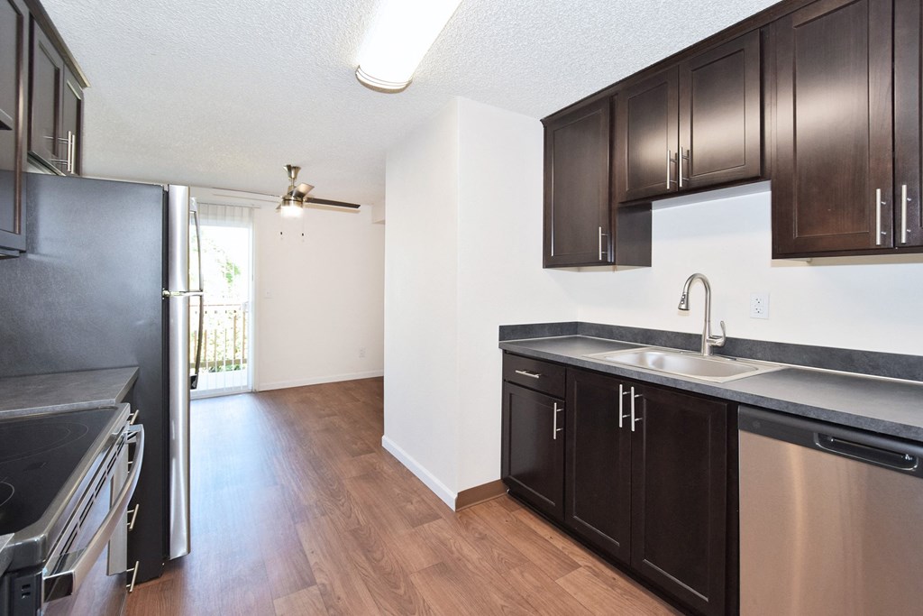a kitchen and dining area in a 555 waverly unit