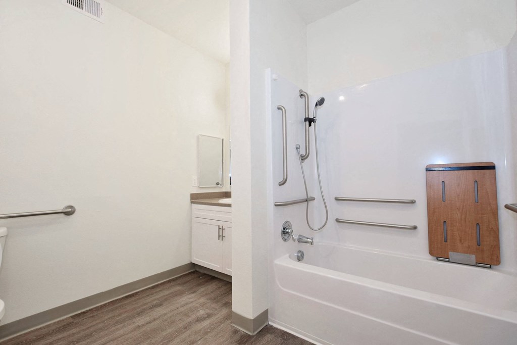 a bathroom with a bathtub and a sink