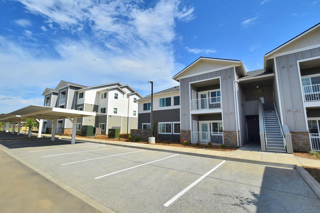 a row of townhomes with a blue sky in the background