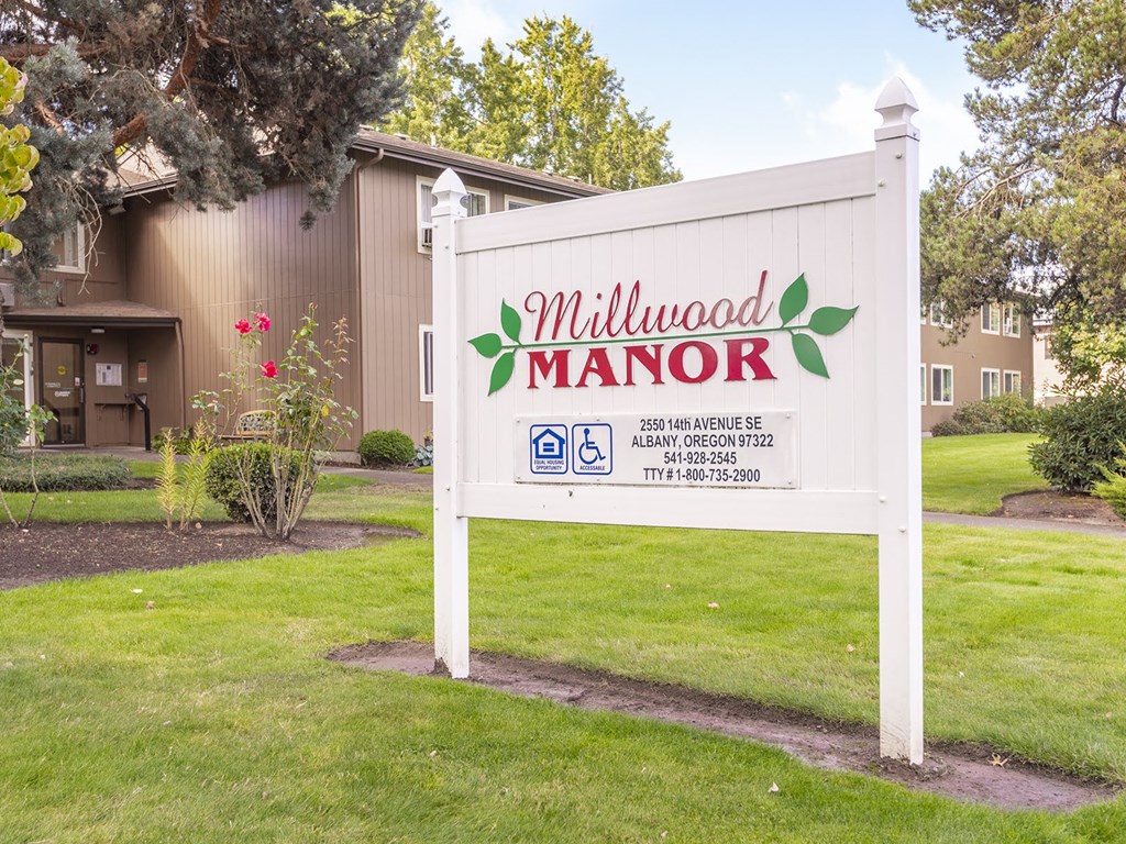 a sign that reads in front of a house