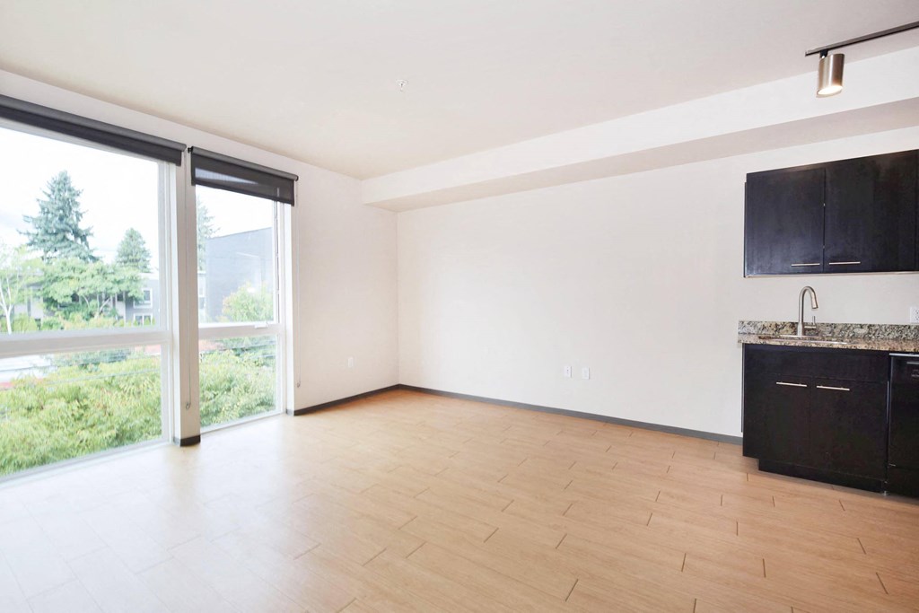 an empty living room with a sliding glass door