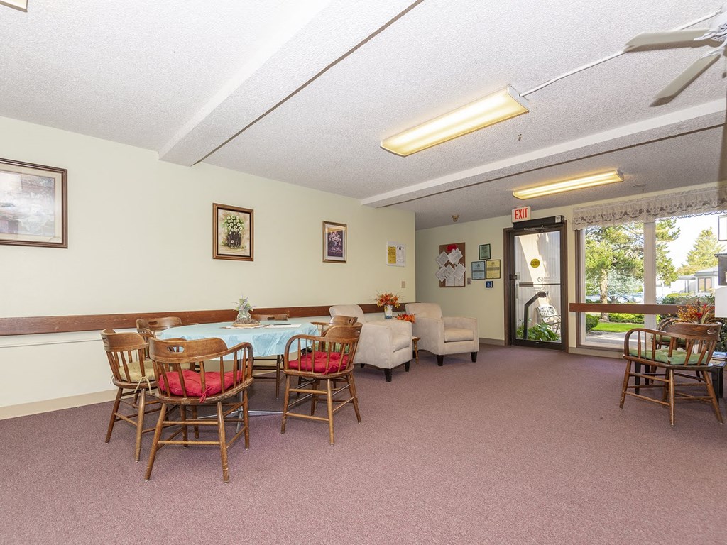 a dining room with a table and chairs