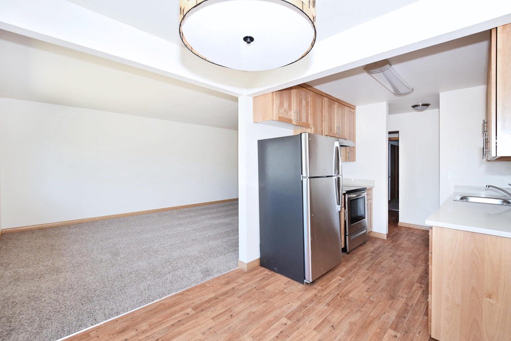 a kitchen and living room in a 555 waverly unit