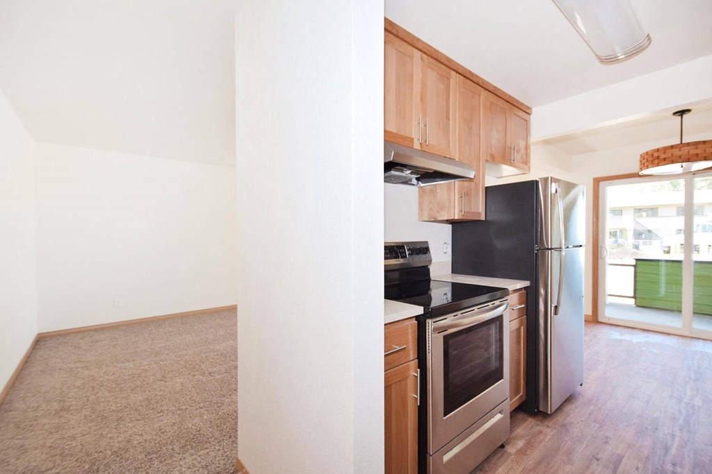 a kitchen and living room in a 555 waverly unit