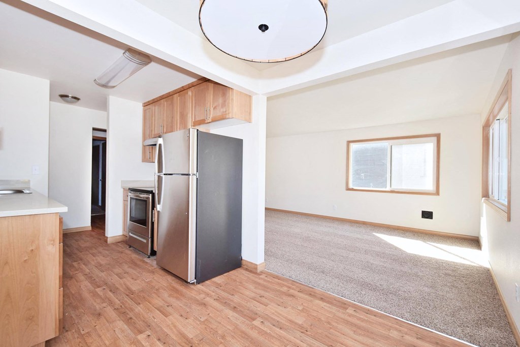 a kitchen and living room in a 555 waverly unit