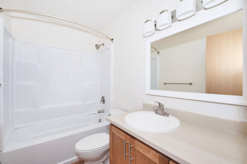 a bathroom with a toilet sink and bathtub