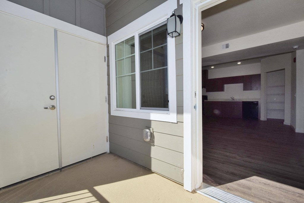 a view of the living room and kitchen from the front porch