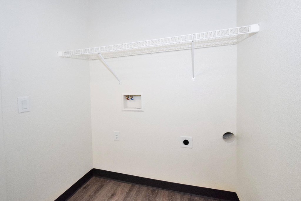 a room with white walls and a wooden floor