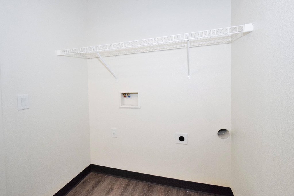 a room with white walls and a wooden floor