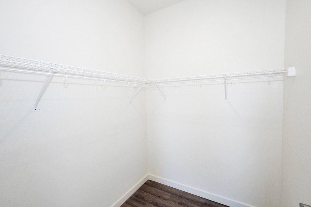 a walk in closet in a 555 waverly unit