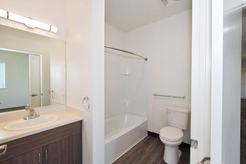 a bathroom with a toilet sink and bathtub