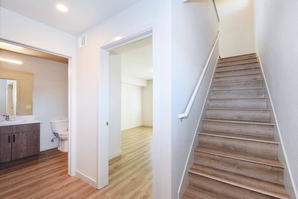 a bedroom with a staircase in a house