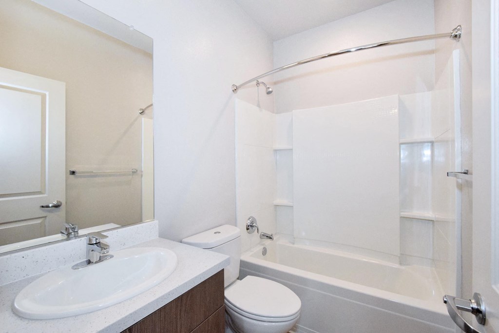 a bathroom with a sink toilet and bathtub