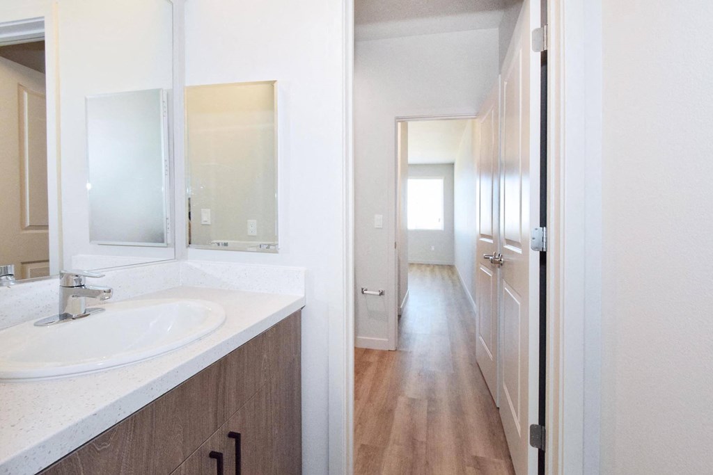 a bathroom with a sink and a mirror