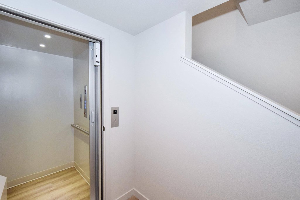 a bedroom with a medium sized bed and a mirror