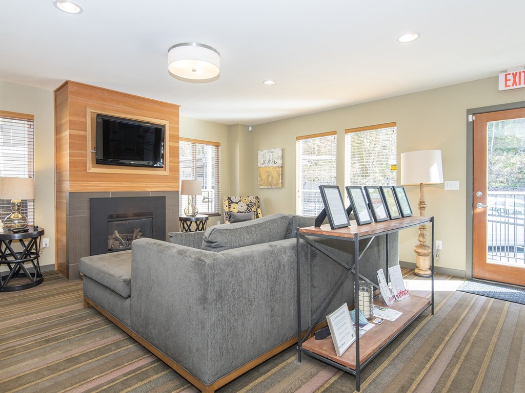 a living room with a couch and a fireplace