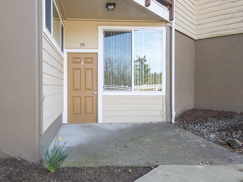 the front door of a home with a porch