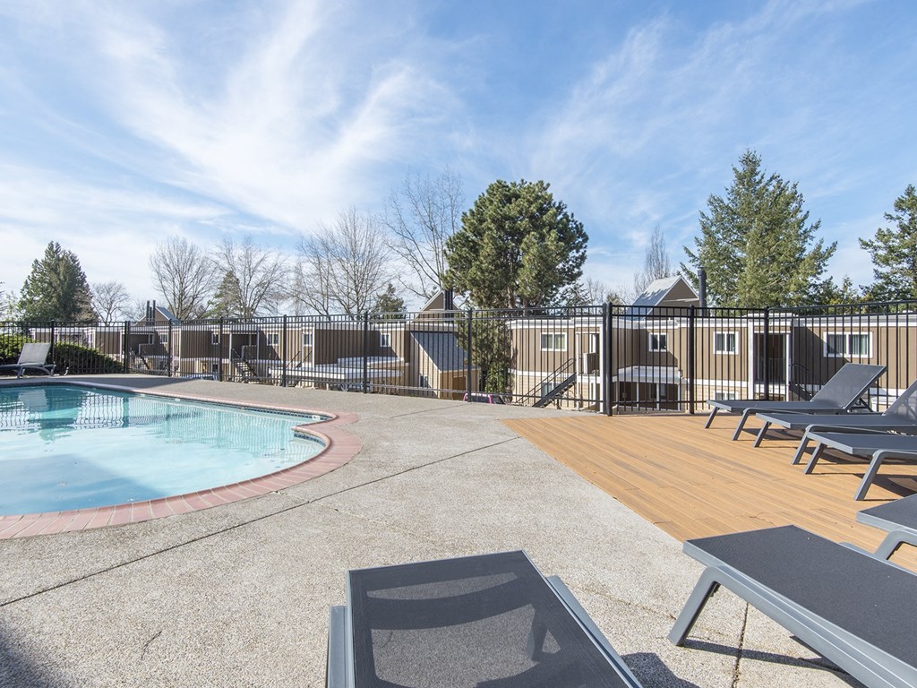 our resort style swimming pool is open to the community and is surrounded by deck chairs