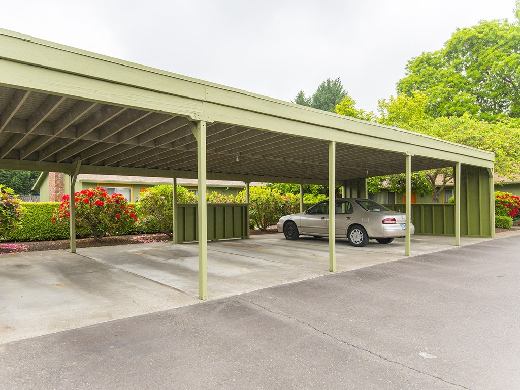a covered parking lot with a car parked under it