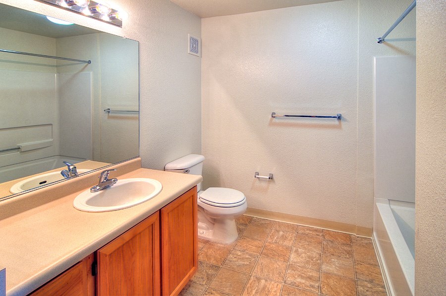a bathroom with a sink toilet and a shower