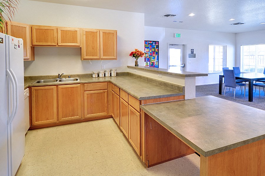 a kitchen with wooden cabinets and a counter top