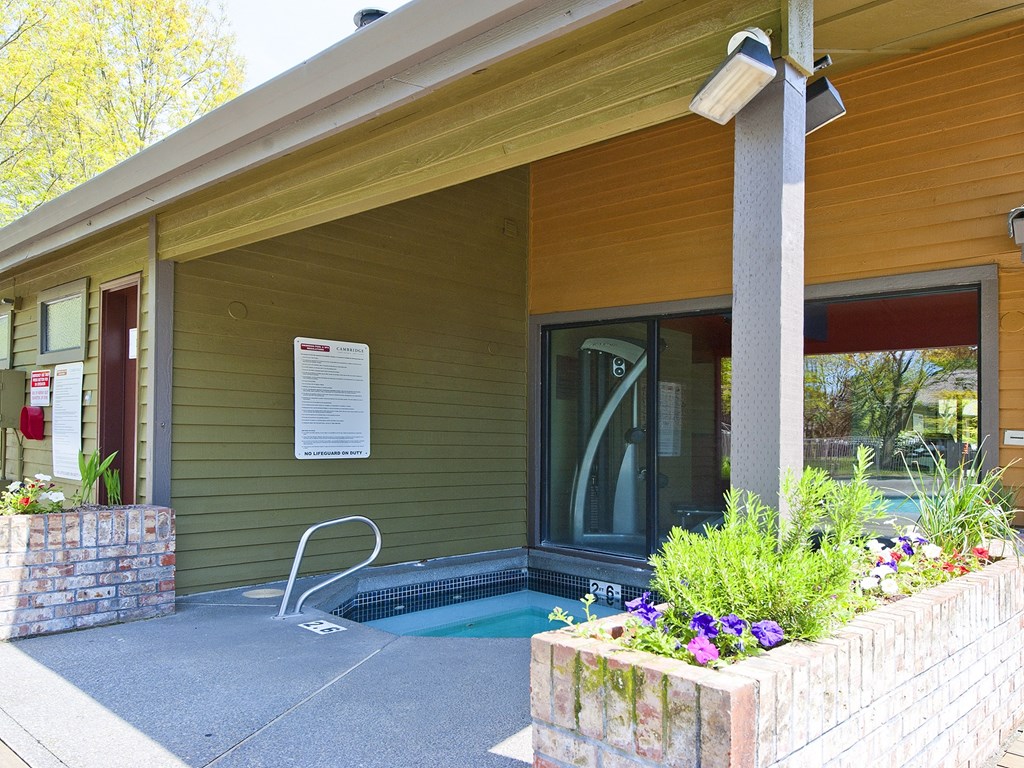 the front of the building with a small jacuzzi