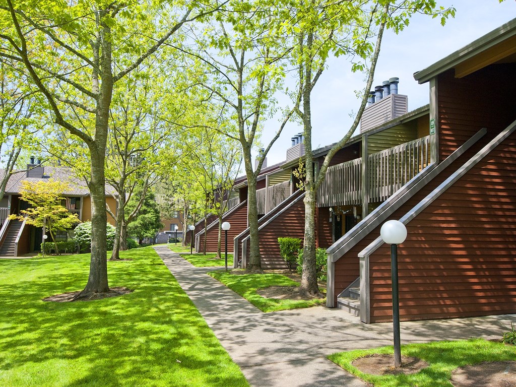 Stone Creek a pathway with trees and buildings on either side