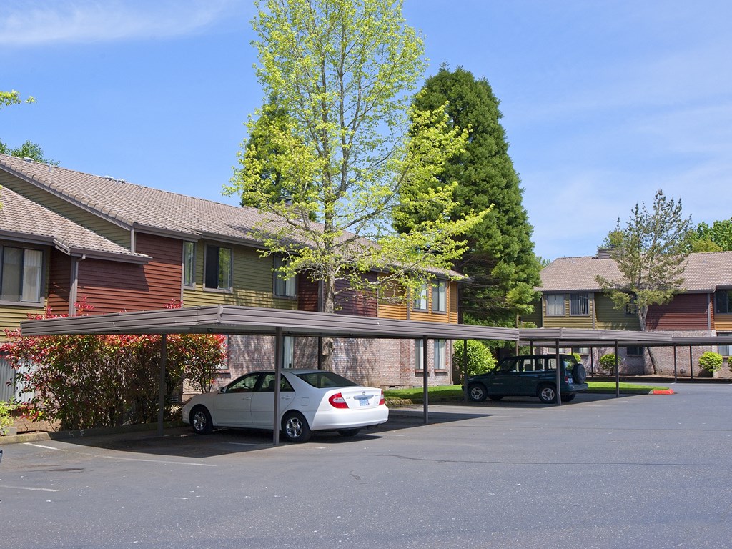 a parking lot at the whispering winds apartments in pearland, tx