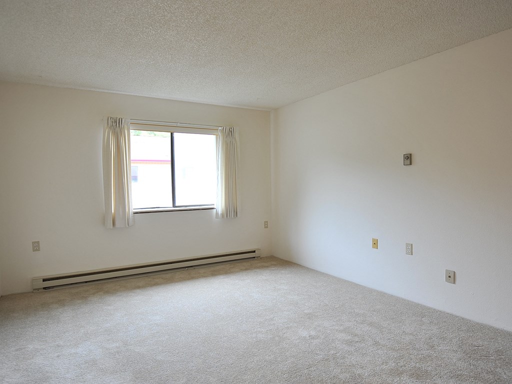 an empty room with a window in it