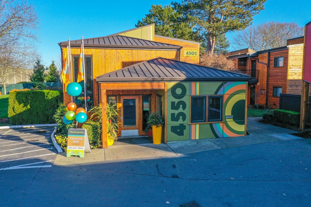 a building with a sign on the side of the street