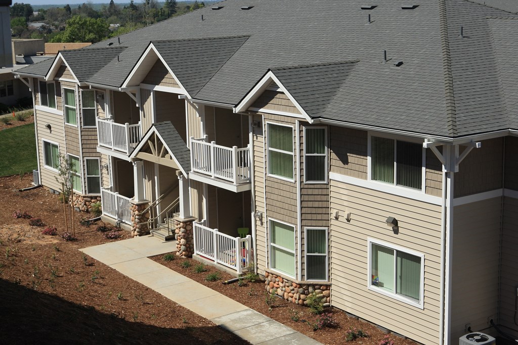 an aerial view of a row of houses with balconies
