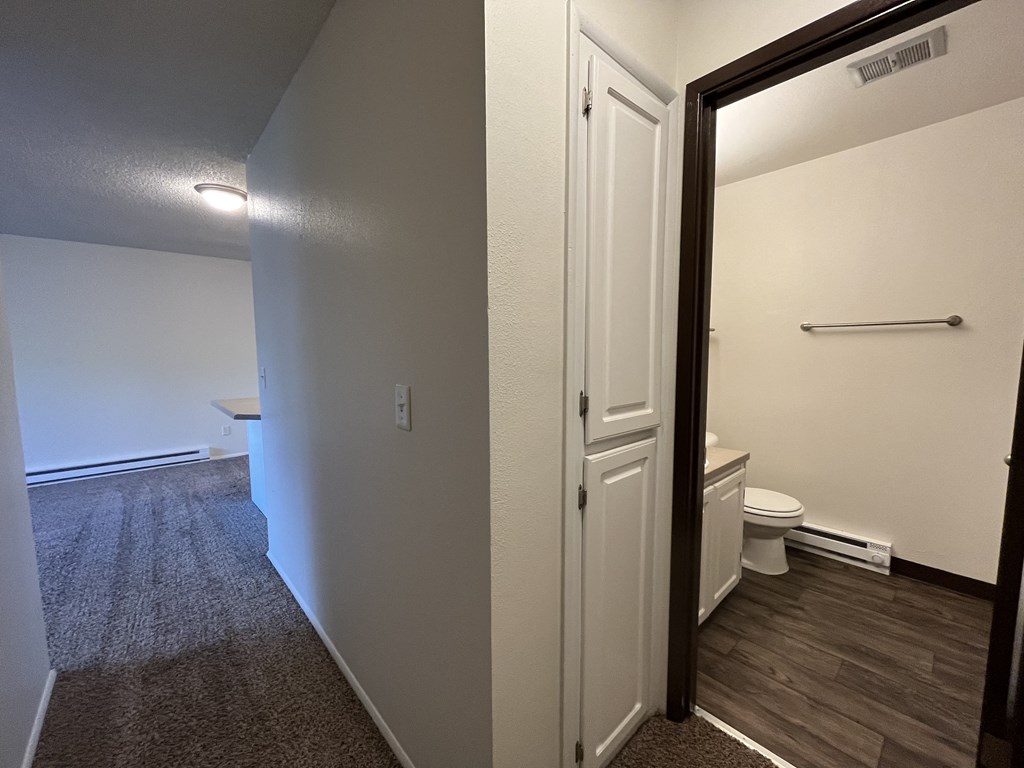 a bedroom with a bed and a mirror