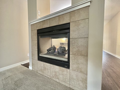 the fireplace in the living room of a new home
