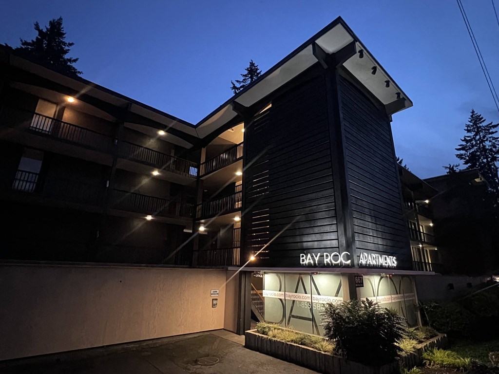 the building where the apartment is located is lit up at night