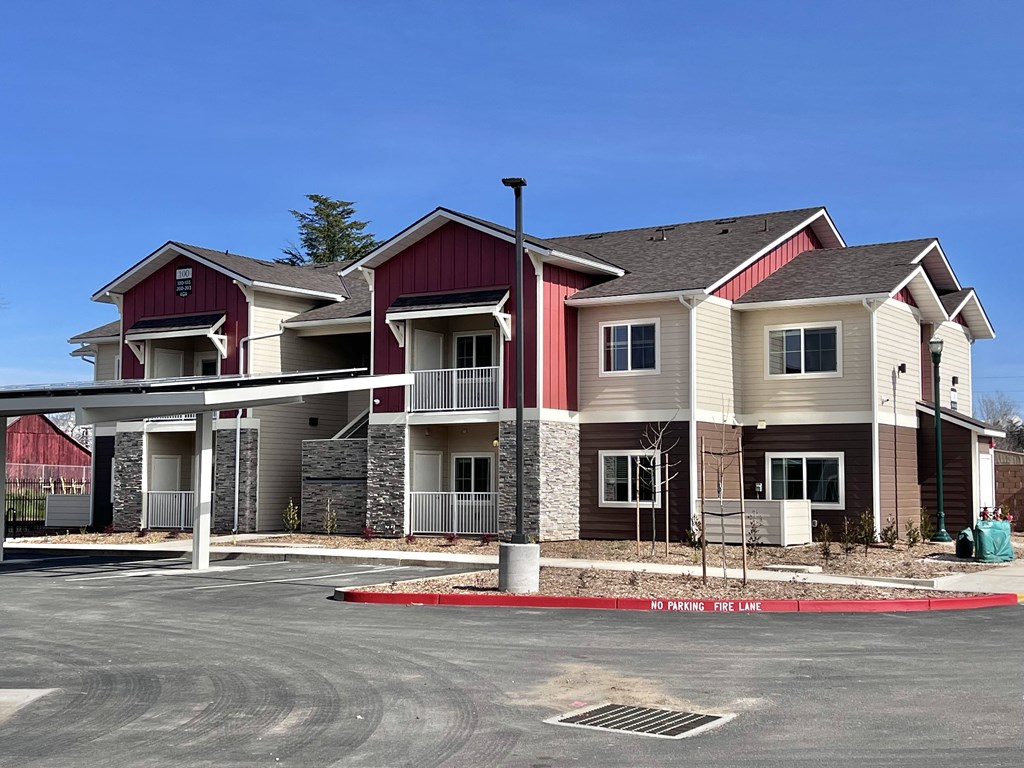 A large building with a red and white facade.