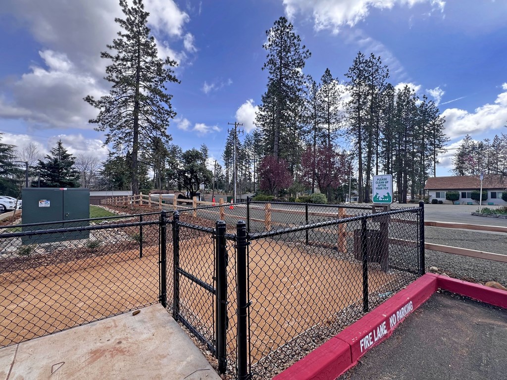 A baseball field with a fence and a sign that says Fire Line.