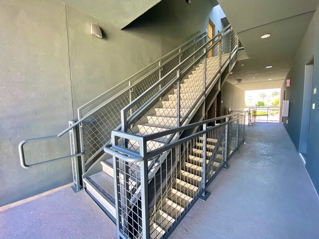 Willow View stairway with wide corridor between apartments