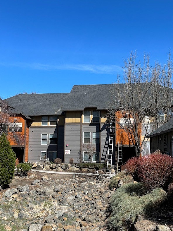 a new roof on a home with a ladder