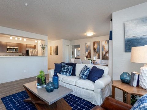 a living room with a white couch and a table