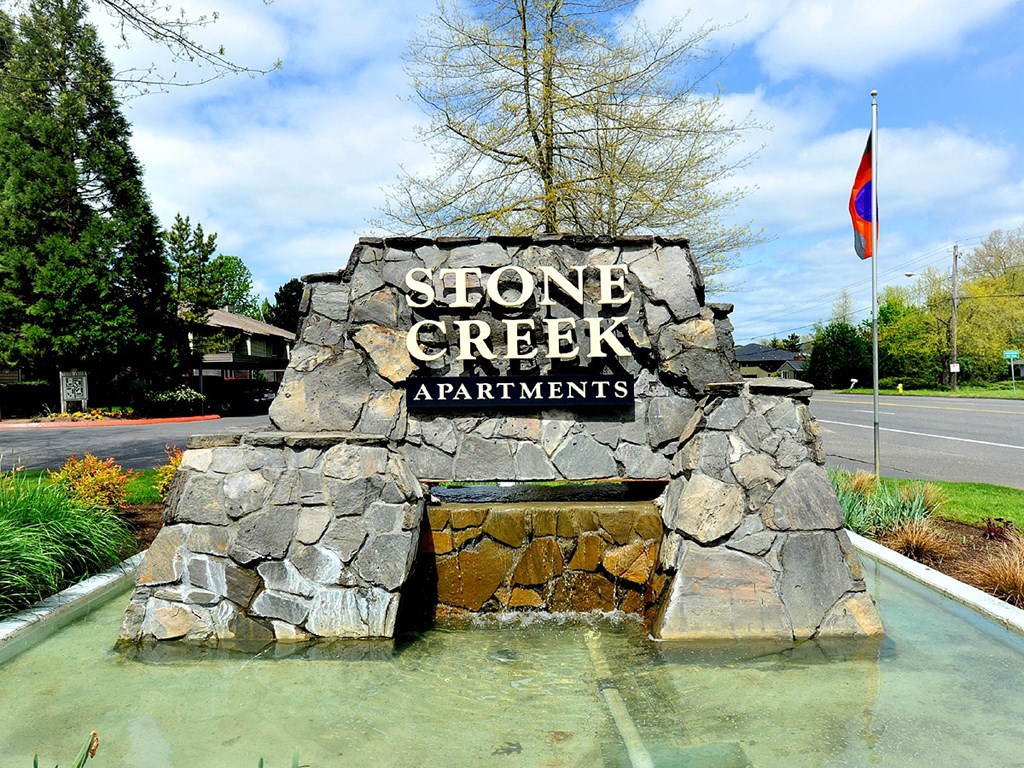 a fountain at stone creek apartments