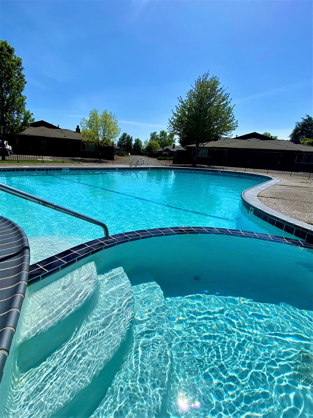 a pool with a blue sky in the background