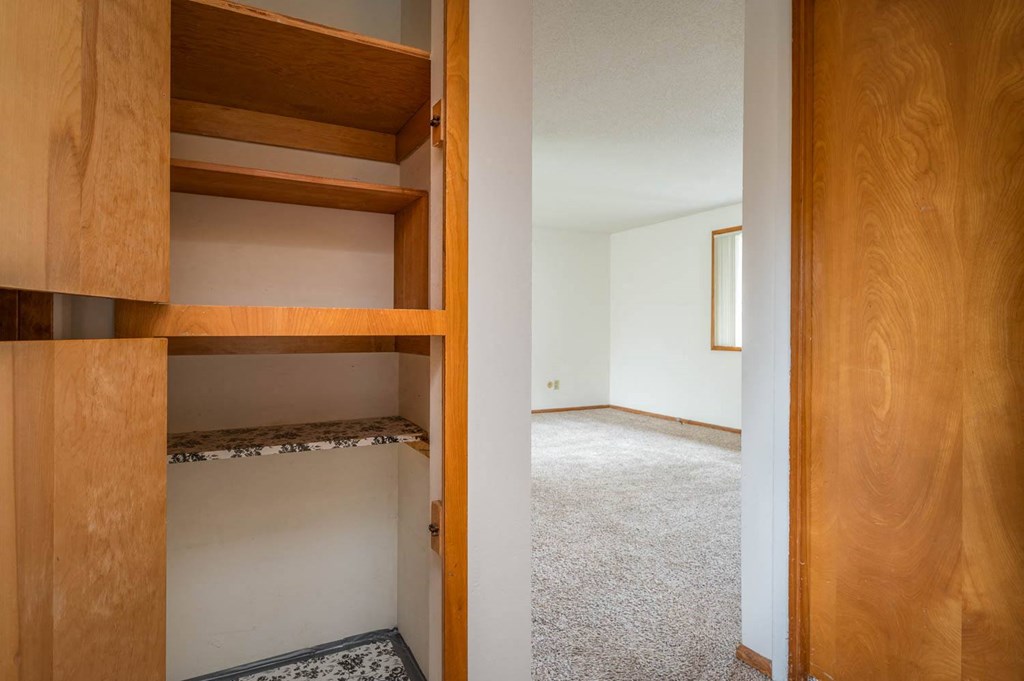a walk in closet in a 555 waverly unit