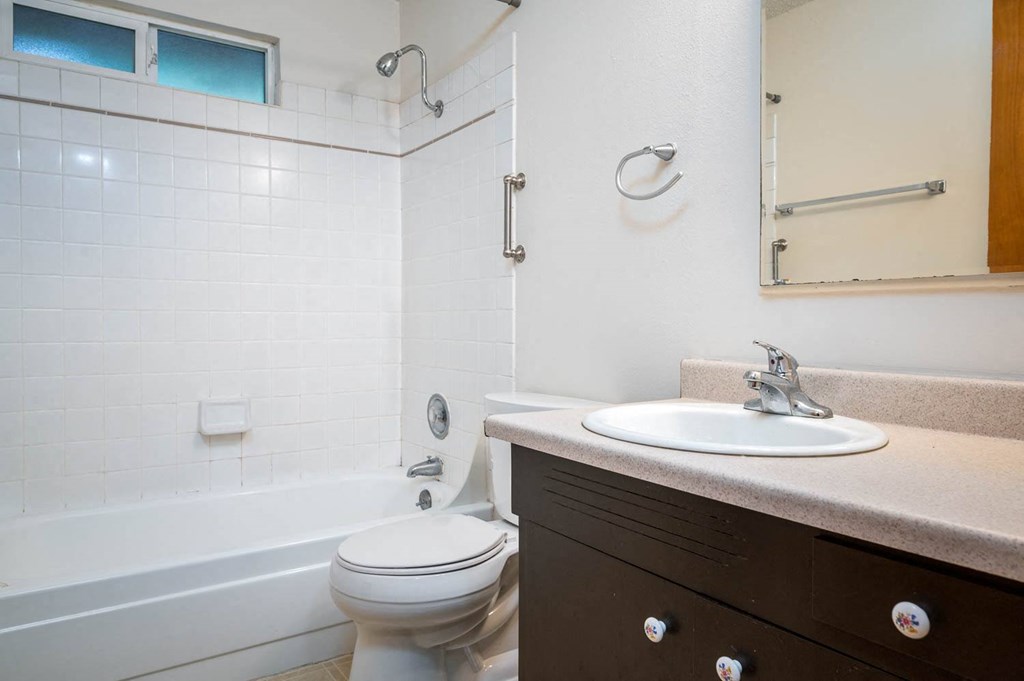 a bathroom with a sink toilet and bathtub