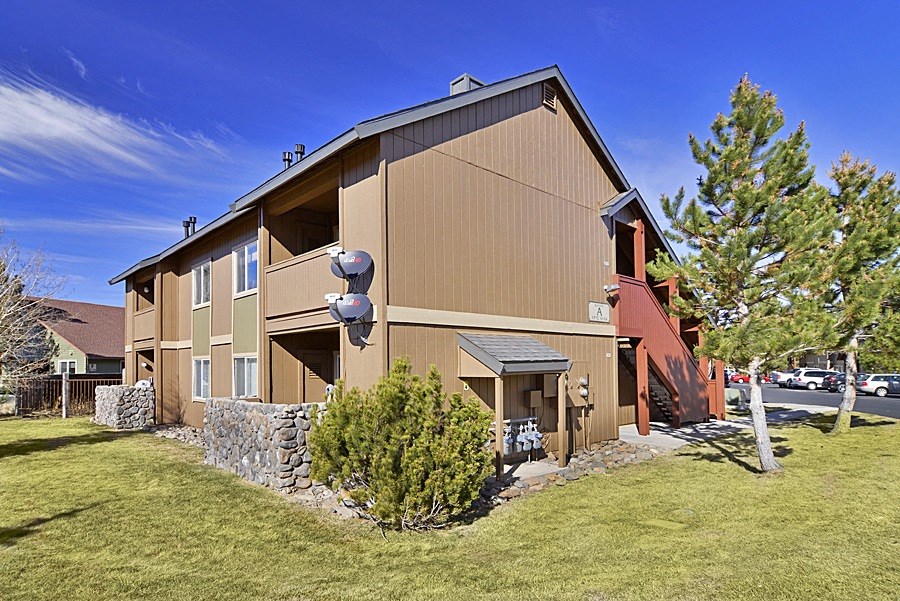 a view of the building with a blue sky in the background