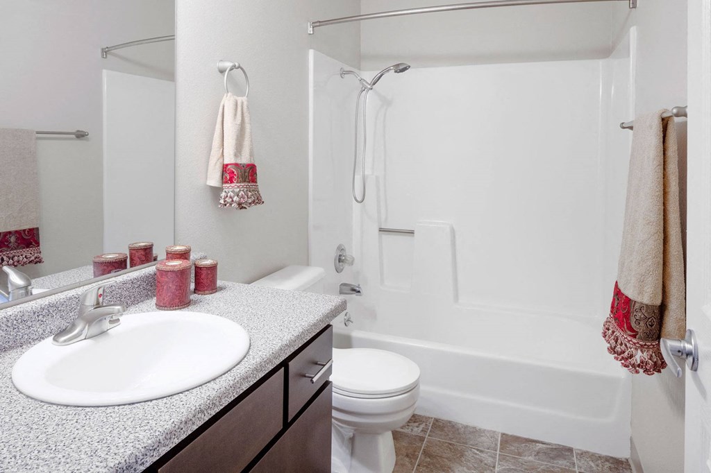 a bathroom with a sink toilet and bathtub