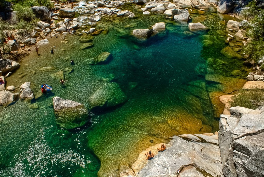 a pool of water with people swimming in it