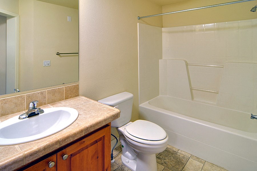 a bathroom with a sink toilet and bathtub