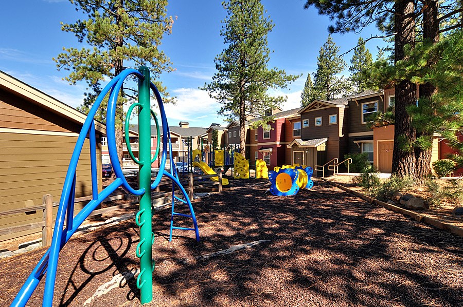 a playground at the enclave at woodbridge apartments in sugar land, tx