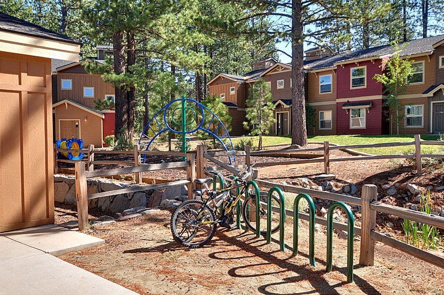 a bike parked in front of a fence